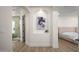 Bright hallway features an alcove with art, and views into the bathroom and bedroom at 1723 W Brianna Rd, Phoenix, AZ 85085