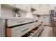 Clean white kitchen featuring ample drawer storage, with fully extended drawers revealing their organized contents at 1723 W Brianna Rd, Phoenix, AZ 85085