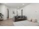 The living room features a comfortable gray couch and decorative rug at 1723 W Brianna Rd, Phoenix, AZ 85085