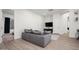 Living room with a sofa, television and carpeted flooring at 1723 W Brianna Rd, Phoenix, AZ 85085