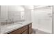 Bathroom featuring granite countertops, modern fixtures, and a glass-enclosed shower at 18169 E Bronco Dr, Queen Creek, AZ 85142