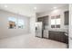 Bright kitchen featuring stainless steel appliances, tile floors, and granite countertops at 18169 E Bronco Dr, Queen Creek, AZ 85142