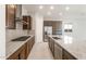 A modern kitchen featuring a gas range, stainless steel hood, and gray tile backsplash at 18169 E Bronco Dr, Queen Creek, AZ 85142