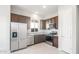 Modern kitchen with stainless steel appliances, ample cabinetry, and granite countertops at 18169 E Bronco Dr, Queen Creek, AZ 85142