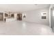 A spacious living room that features tile flooring and an open concept floor plan at 18169 E Bronco Dr, Queen Creek, AZ 85142