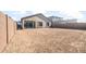Expansive backyard featuring block fence, covered patio and room to create your private backyard oasis at 18180 E Tiffany Dr, Queen Creek, AZ 85142