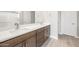Bathroom features double sinks with modern fixtures and a large mirror at 18180 E Tiffany Dr, Queen Creek, AZ 85142