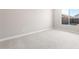 Empty bedroom is carpeted and shows a window at 18180 E Tiffany Dr, Queen Creek, AZ 85142