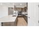 Modern kitchen features stainless appliances, a large island, white countertops, and stylish cabinetry at 18180 E Tiffany Dr, Queen Creek, AZ 85142