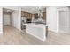 Modern kitchen with stainless steel appliances, island, and contemporary cabinetry at 18180 E Tiffany Dr, Queen Creek, AZ 85142