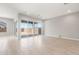 Bright, open living area featuring tile floors and large sliding glass doors to the yard at 18180 E Tiffany Dr, Queen Creek, AZ 85142