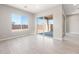 Spacious living area offers natural light through a large window and sliding glass door at 18180 E Tiffany Dr, Queen Creek, AZ 85142
