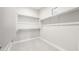 Bright walk-in closet with carpet floors and ample shelving for maximum storage and organization at 18180 E Tiffany Dr, Queen Creek, AZ 85142