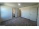 Bright bedroom featuring gray carpet and an ensuite bathroom at 1963 E Harness Ln, San Tan Valley, AZ 85140