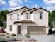Two-story house with beige exterior, brown garage door, and landscaping at 1963 E Harness Ln, San Tan Valley, AZ 85140