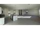 Open concept kitchen with island, granite countertops, and view of living room at 1963 E Harness Ln, San Tan Valley, AZ 85140