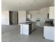 Modern kitchen with granite countertops, island, and stainless steel appliances at 1963 E Harness Ln, San Tan Valley, AZ 85140