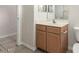 Bathroom with a vanity, a sink with chrome fixtures, and a framed mirror at 19850 N 110Th Ln, Peoria, AZ 85373