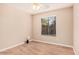 Bright bedroom with ceiling fan, neutral walls, window views and wood-look laminate flooring at 19850 N 110Th Ln, Peoria, AZ 85373