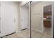 Entryway features tile floors, a coat rack, and an adjacent mirrored closet at 19850 N 110Th Ln, Peoria, AZ 85373