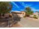 Charming single-story home with a well-maintained front yard and two-car garage at 19850 N 110Th Ln, Peoria, AZ 85373