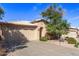 Inviting single-story home with a well-manicured front yard and a convenient two-car garage at 19850 N 110Th Ln, Peoria, AZ 85373