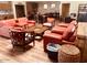 Inviting resident lounge with leather seating, fireplace, library, and vending machines at 19850 N 110Th Ln, Peoria, AZ 85373
