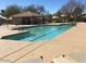 Outdoor community pool with lap lanes, lounge chairs, and shaded patio area at 19850 N 110Th Ln, Peoria, AZ 85373