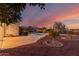 Tranquil backyard view with a pool, desert flora, and mountain views at 20914 W Cora Vis, Buckeye, AZ 85396