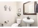 Stylish powder room features modern fixtures and tasteful decor at 20914 W Cora Vis, Buckeye, AZ 85396