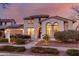 Charming two-story home boasts mature landscaping, a welcoming entrance and a two car garage at 20914 W Cora Vis, Buckeye, AZ 85396