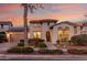 Charming two-story home boasts mature landscaping, a welcoming entrance, a two car garage, and solar panels at 20914 W Cora Vis, Buckeye, AZ 85396