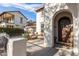 Inviting entrance with cozy seating, a 'Welcome' sign, and a well-maintained yard at 20914 W Cora Vis, Buckeye, AZ 85396