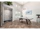Bright game room features a ping pong table, high ceilings, and tiled floors at 20914 W Cora Vis, Buckeye, AZ 85396