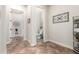 Hallway with tile flooring provides access to a half bathroom and other rooms, creating a flowing layout at 20914 W Cora Vis, Buckeye, AZ 85396