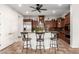 Kitchen featuring granite countertops, wooden cabinets, and barstool seating at 20914 W Cora Vis, Buckeye, AZ 85396