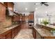 Modern kitchen featuring granite countertops and stainless steel appliances at 20914 W Cora Vis, Buckeye, AZ 85396