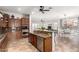 Open-concept kitchen with granite countertops, stainless appliances, and an island at 20914 W Cora Vis, Buckeye, AZ 85396