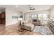 Bright living room with sectional couch, neutral tones, and plenty of windows at 20914 W Cora Vis, Buckeye, AZ 85396