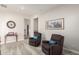 Inviting living room with plush chairs, decorative accents, and carpet flooring offers a comfortable gathering space at 20914 W Cora Vis, Buckeye, AZ 85396