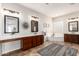 Elegant bathroom featuring a soaking tub, dual vanities, and stylish fixtures at 20914 W Cora Vis, Buckeye, AZ 85396