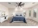 Bright main bedroom featuring a ceiling fan, plush carpet and natural lighting at 20914 W Cora Vis, Buckeye, AZ 85396