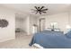 Spacious main bedroom featuring plush carpet, stylish ceiling fan, and natural light at 20914 W Cora Vis, Buckeye, AZ 85396