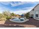 Home featuring a backyard pool and mature landscaping for ultimate relaxation and privacy at 20914 W Cora Vis, Buckeye, AZ 85396
