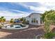 Home featuring a backyard swimming pool, palm trees, and mature landscaping for ultimate relaxation and privacy at 20914 W Cora Vis, Buckeye, AZ 85396