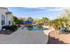 Inviting backyard pool area features a lounge area, desert landscaping, and mountain views at 20914 W Cora Vis, Buckeye, AZ 85396