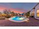 Inviting backyard pool with colorful sky and thoughtfully placed landscaping at 20914 W Cora Vis, Buckeye, AZ 85396