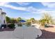 Inviting backyard pool area features desert landscaping, and mountain views beyond the wrought iron fence at 20914 W Cora Vis, Buckeye, AZ 85396