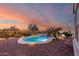 Backyard pool with desert landscaping, perimeter lighting, and a serene sky at 20914 W Cora Vis, Buckeye, AZ 85396