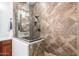 Tiled shower with glass enclosure and sleek fixtures at 20914 W Cora Vis, Buckeye, AZ 85396
